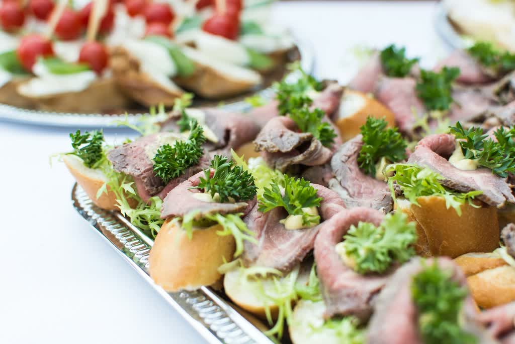 Roast beef on ciabatta, served on a silver tray.