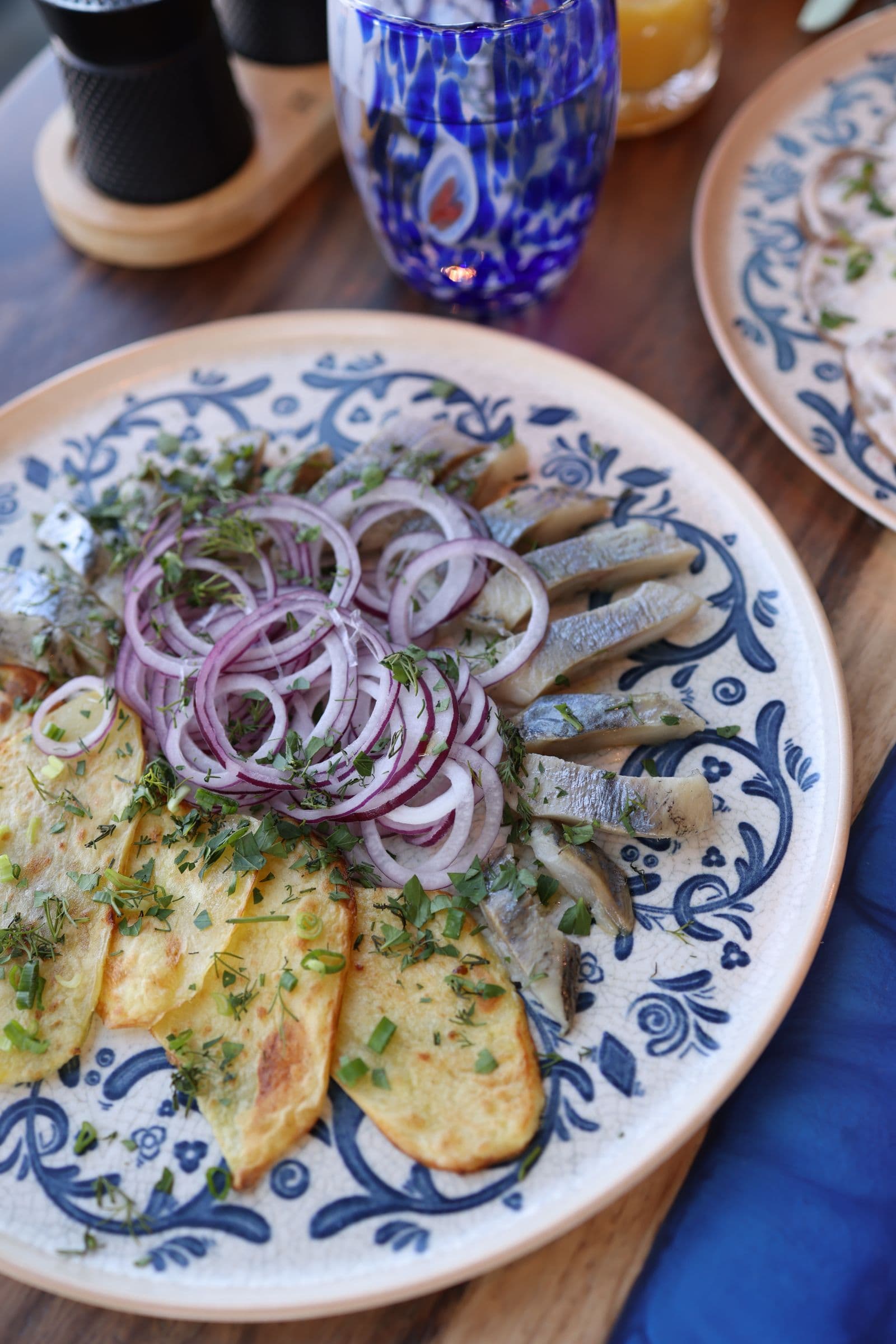 Herring with pickled onion and pickled cucumber