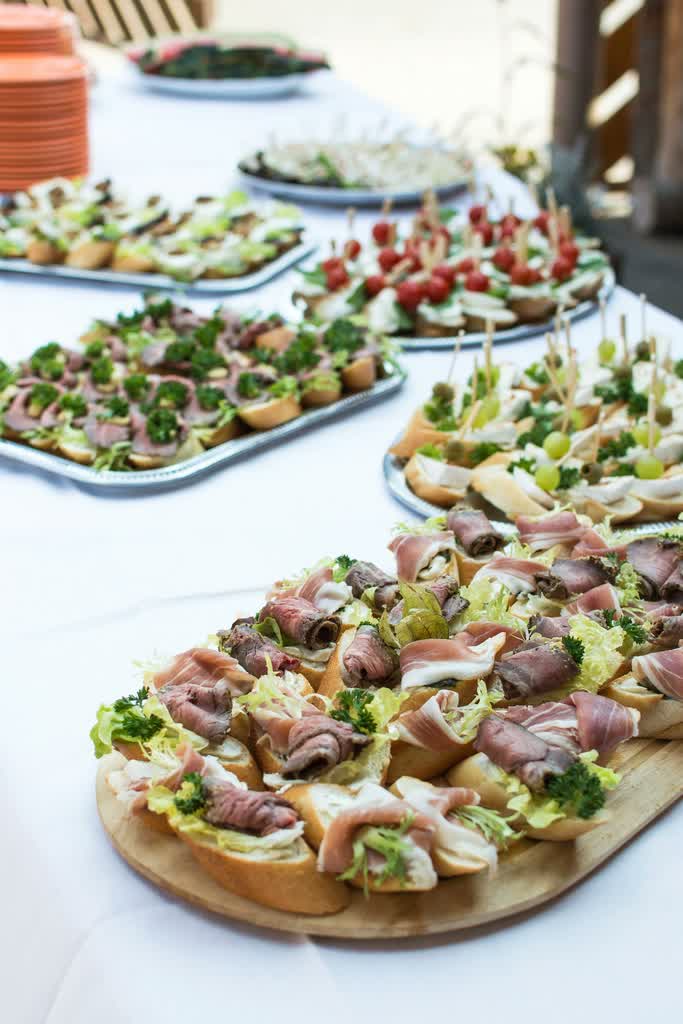 A uniform spread of starters on a wooden board.