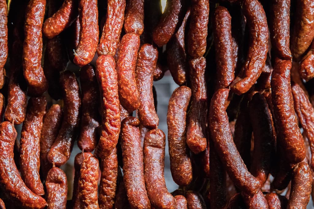 Smoked sausages hanging to cure.