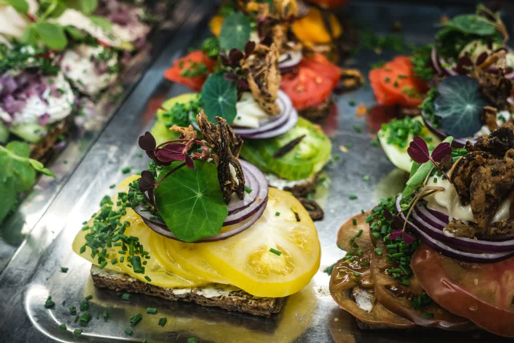 Close-up of canapés on a metal tray.